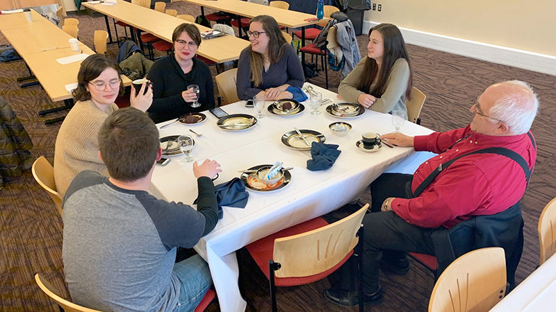 Students, faculty, and families enjoying lunch