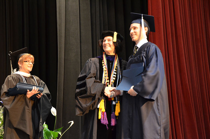 Chancellor and Dean Lori J. Bechtel-Wherry poses for a photo with a graduate