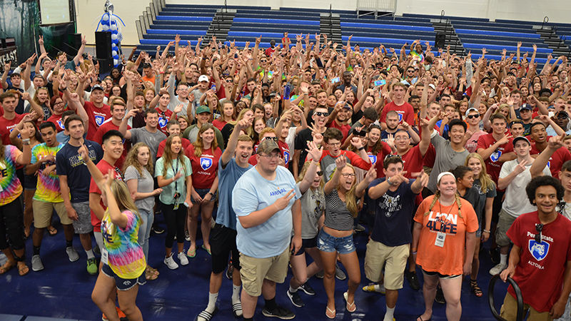 The class of 2021 and their orientation leaders pose for a group photo