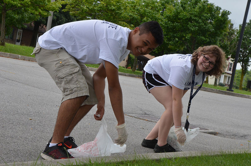First year students clean up the street as part of Voluntoona