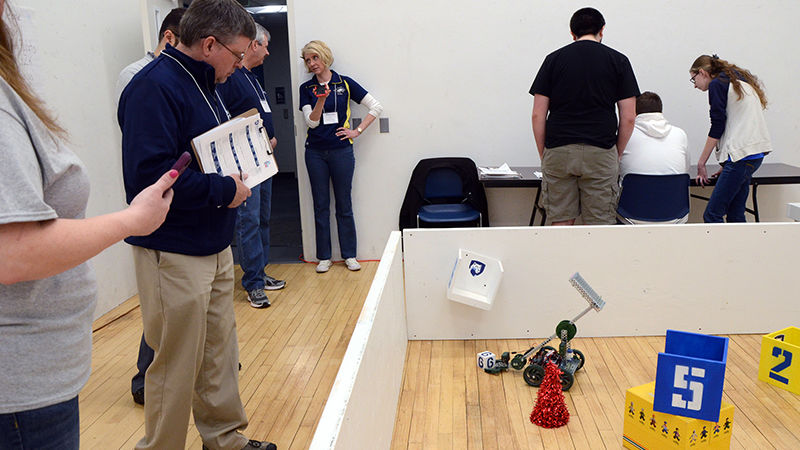 Judges observe students competing in the land portion of the SeAL challenge on Friday, April 12 at Penn State Altoona.