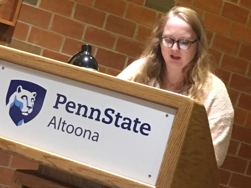 A student reading at the spring 2019 Hard Freight Cafe