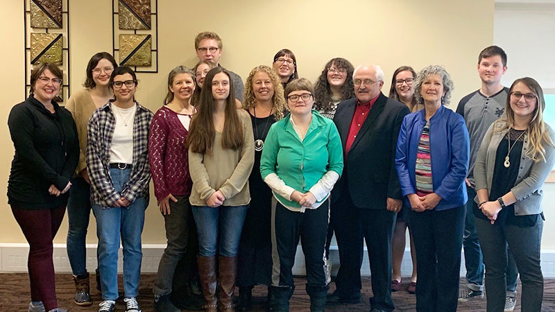 Students pose with faculty members