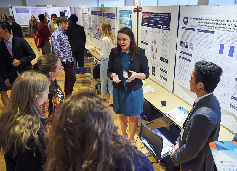 Rachel Bruning explains her poster to other students