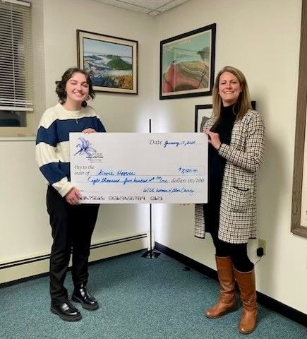 Penn State Altoona student Stevie Hoover receives a scholarship from the WISE Women of Blair County, presented by WISE Women Board President and Scholarship Chair Mandy Michelone.