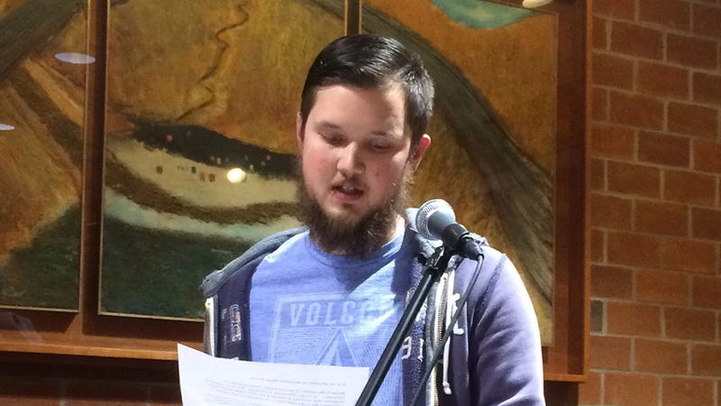 A student reading at the spring 2018 Hard Freight Cafe