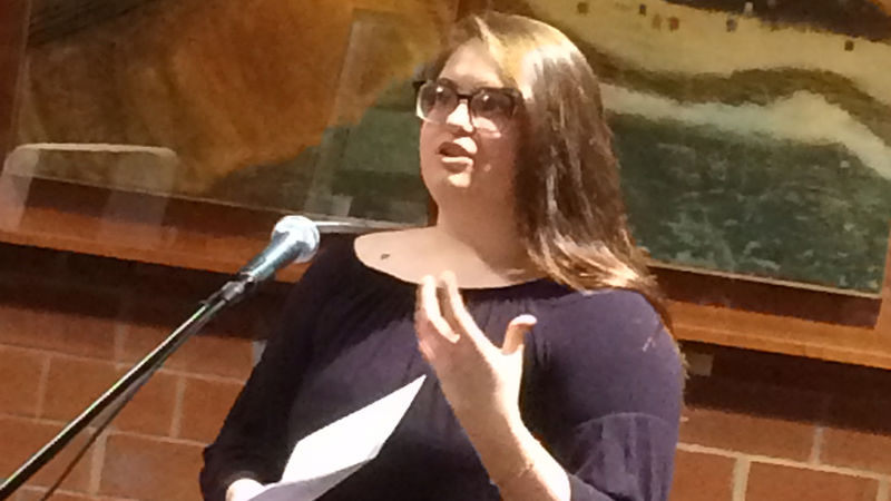 A student reading at the spring 2018 Hard Freight Cafe