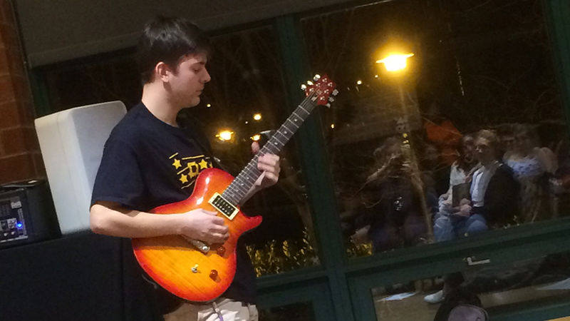 A student performing at the spring 2018 Hard Freight Cafe
