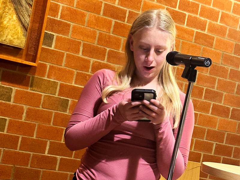 Student Marissa Ebersole reads a poem