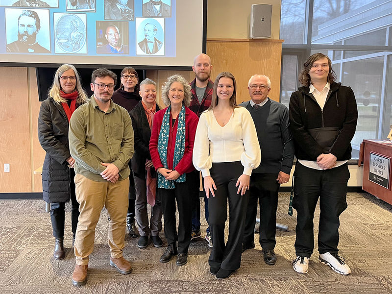 Associate Professor of German, English, and Comparative Literature Jutta Gsoels-Lorensen; student Aidan Pellegrino; Associate Professor of English and Women's, Gender, and Sexuality Studies Megan Simpson; Associate Professor of English Laura Rotunno; Distinguished Professor of English and American Studies Sandra Petrulionis; Assistant Professor of English Jeffery Stoyanoff; student Ella Gable; Associate Professor Emeritus of English Tom Liszka; and student Brian Burkhardt.