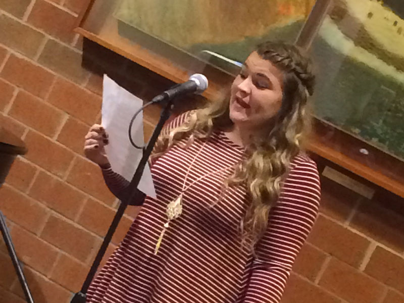 A student offers a reading as part of the Hard Freight Cafe.
