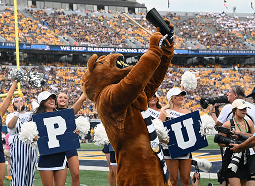 Nittany Lion plays cowbell