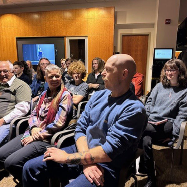 The crowd enjoys a joke by Jeffery Stoyanoff, assistant professor of English and Women's, Gender, and Sexuality Studies.