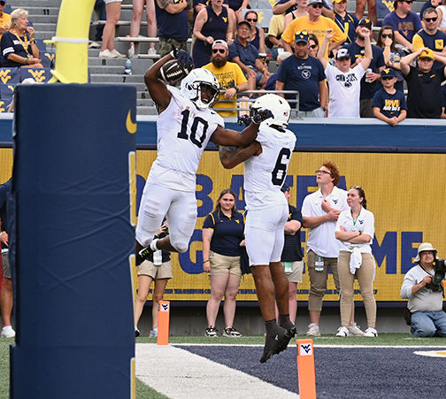 Singleton jumps in air in celebration