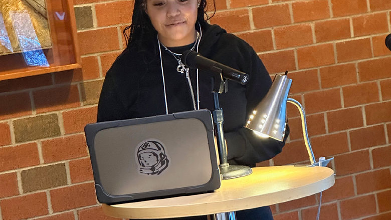 Student Zaria Williams reads an original poem