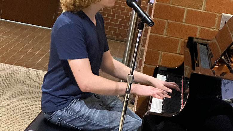 Levi Custer performs a song.