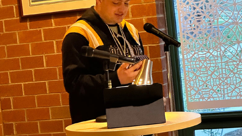 Student Reilly Keen reads an original poem based on The Raven by Edgar Allan Poe.