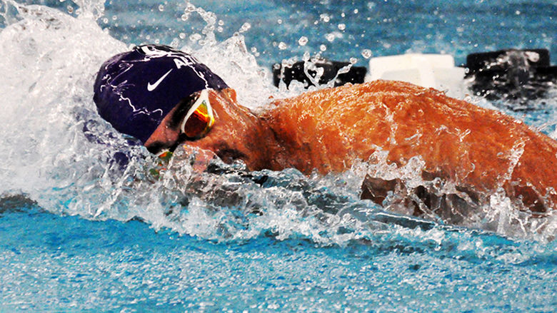Penn State Altoona student-athlete Adam Marawn competing in a swim meet