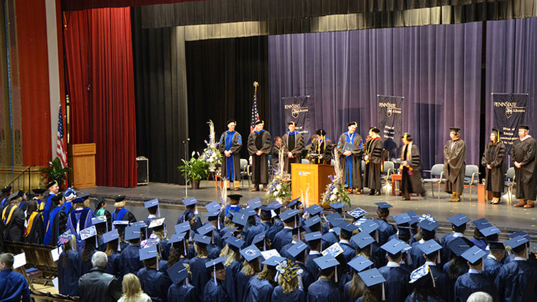 The graduates and the stage party at Fall 2016 Commencement