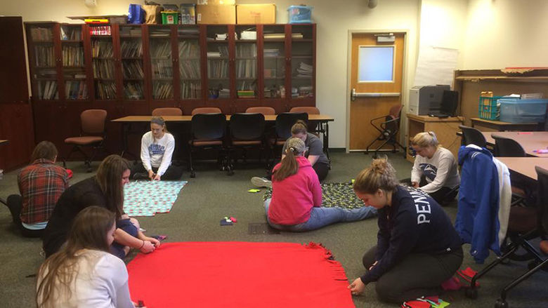 Kappa Delta Pi students work on the Literacy Alive project