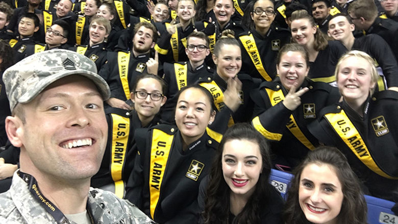 Shepro poses for a selfie with members of the All-American Bowl marching band.
