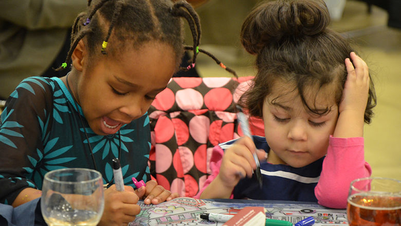Two children enjoy the 2017 MLK Reflection Luncheon