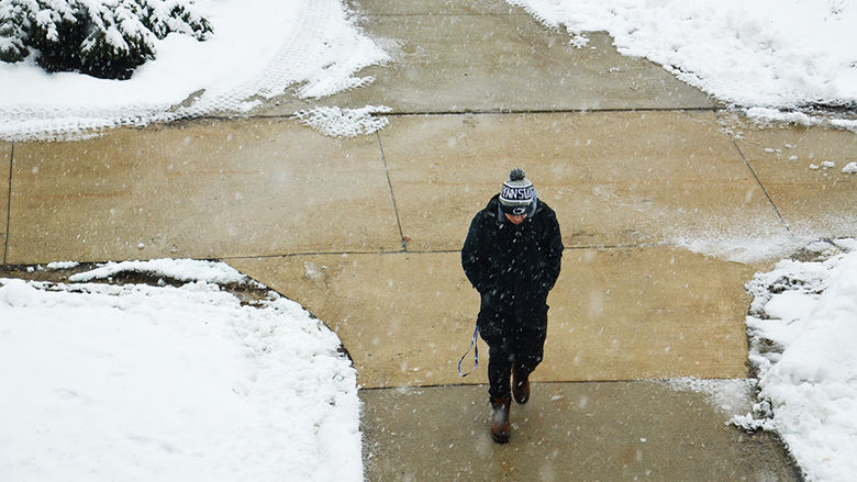 a student walks on campus