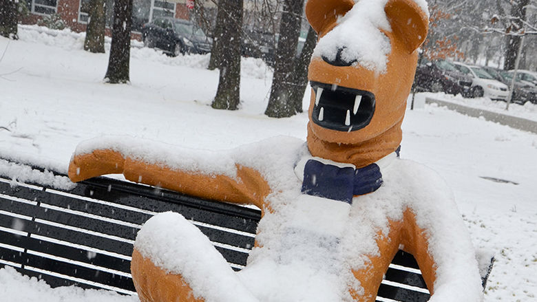 snow-covered lion statue
