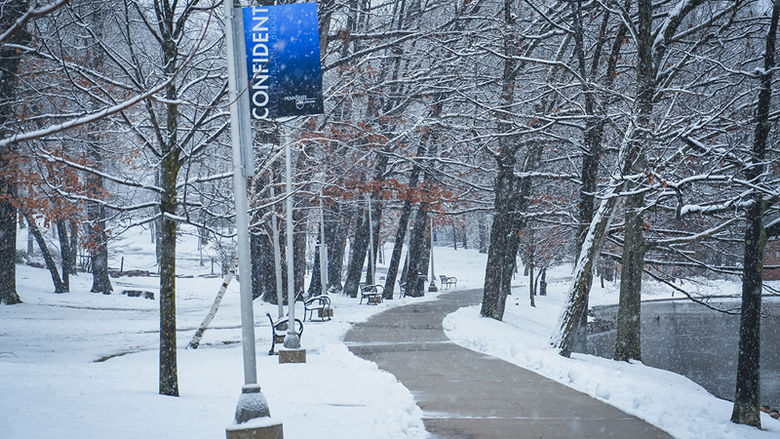 A snowy path on campus