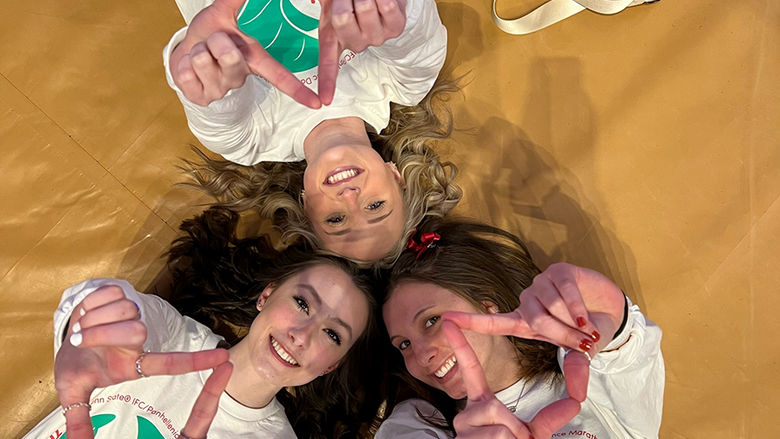 Neya Kratzer (lower left), Taylor Fleming (upper left), and Caroline Baum pre-THON