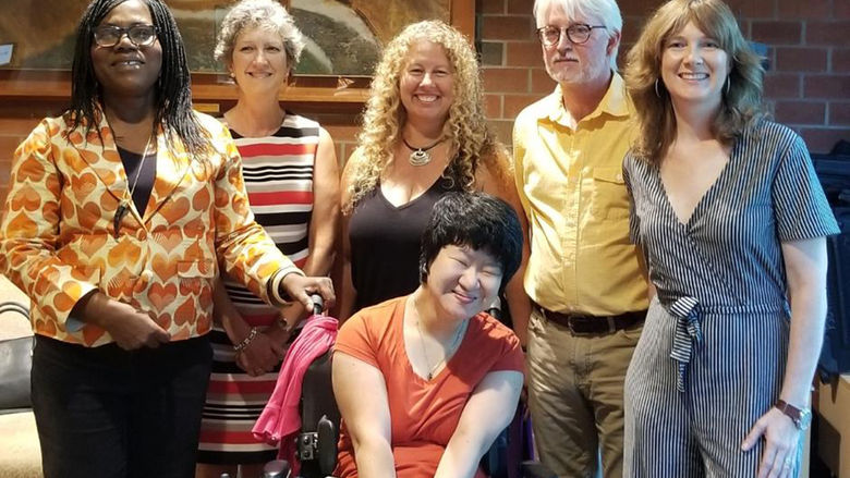 Faculty pose with Erin Kelly at her Chapbook celebration