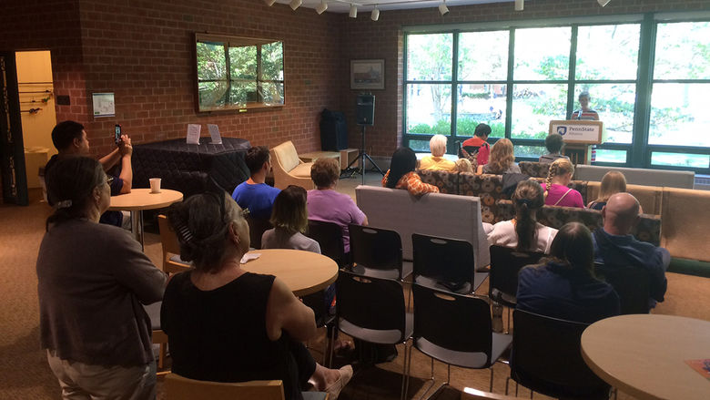 The audience listens as a faculty member reads from Erin Kelly's new Chapbook