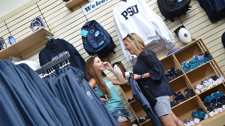 Two ladies chatting in the Penn State Bookstore