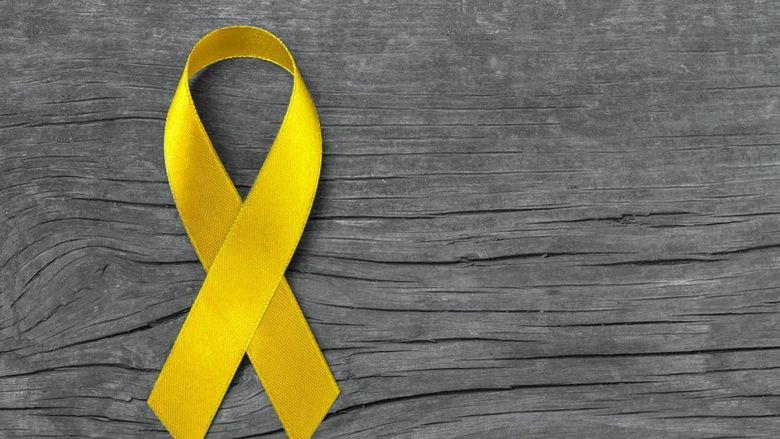 A yellow ribbon representing suicide awareness and prevention