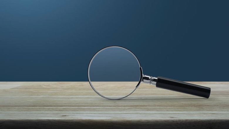 A magnifying glass laying on a table