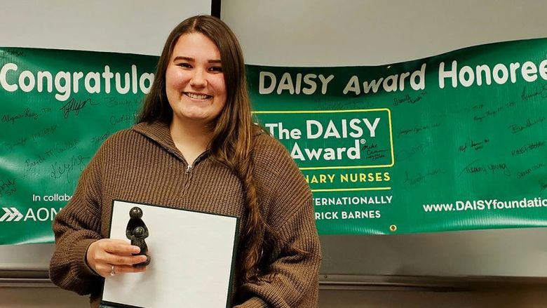 Nursing student Alexis Christoff with her DAISY award