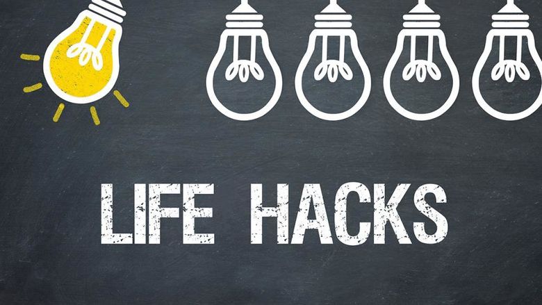 A series of lightbulbs on a chalkboard background, with the first one lit and swinging. Below, the words LIFE HACKS are written in bold, white text, symbolizing practical tips and ideas.