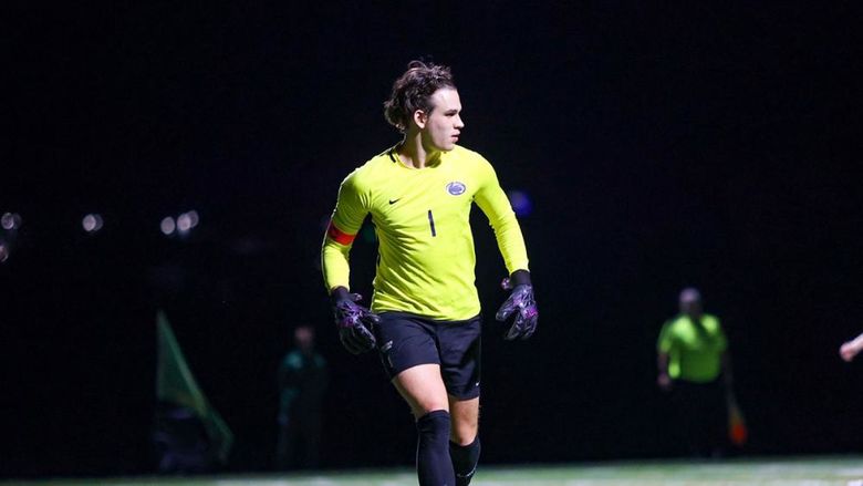 Sasha Mohoruk playing goalie in the middle of a soccer game