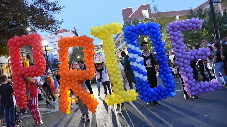 Five students hold balloons spelling PRIDE in the 2019 Altoona Pride Parade