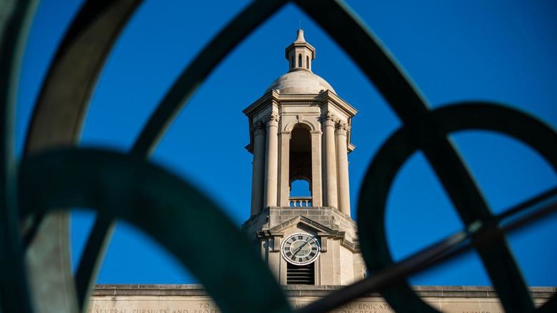 Old Main bell tower seen through armillary sphere sculpture