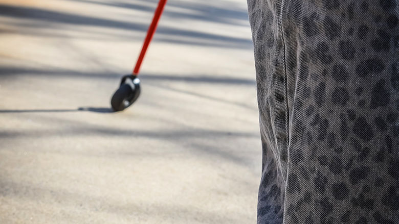 Parrish navigates campus with the help of her mobility cane.