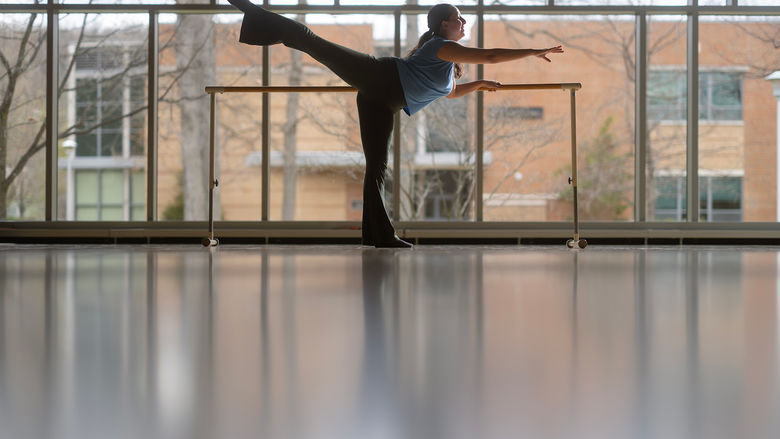 A student dancer warming up in the Penn State Altoona dance studio