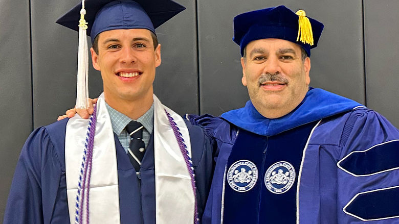 Honors graduate Casey Hell (left) with Dr. Grant Risha.