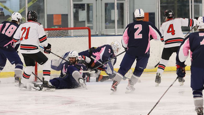 Roan McCormick and Jake Fabricant fight at the net at a home game against California University.