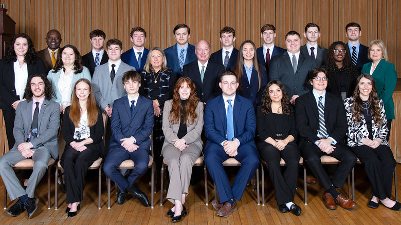 A group of students, faculty, staff and donors posing for a photo at the induction of the 14th class of Sheetz Fellows
