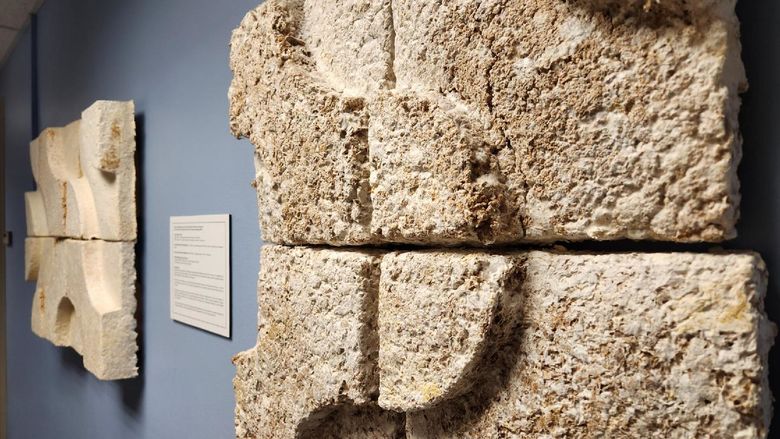 Image of neutral-colored blocks on a wall.