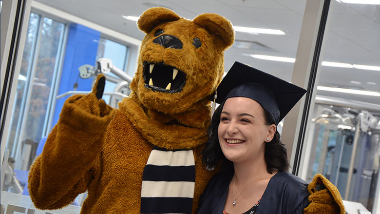 Posing with the Nittany Lion at Altoona's fall 2018 commencement