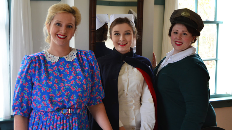 Women dressed in WWII-period clothing