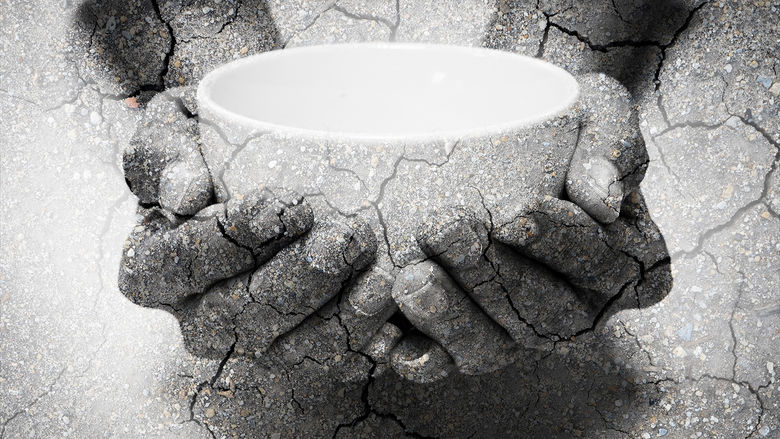 Hands holding an empty bowl