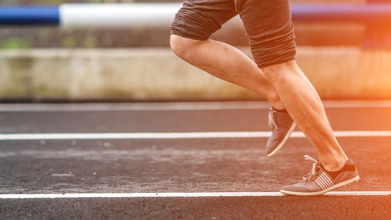 Man running on track.